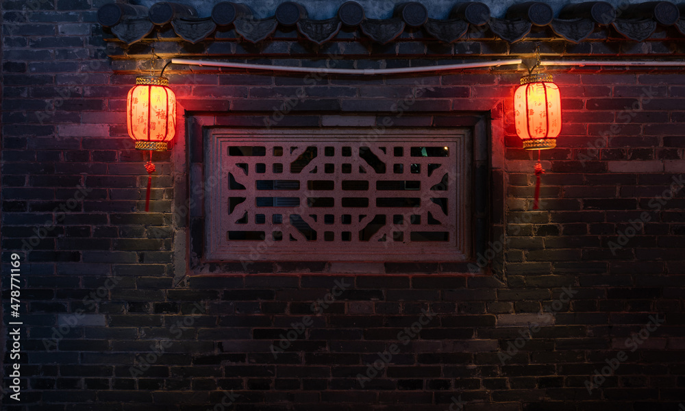 Under the eaves of the ancient city wall, lanterns with Chinese ...