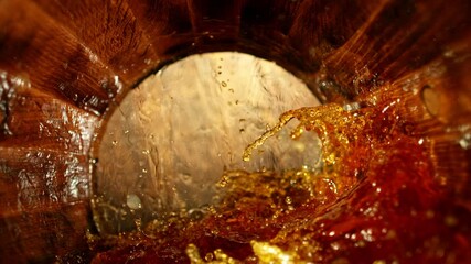 Poster - Super slow motion of pouring whiskey, rum or cognac inside the barrel. Filmed on high speed cinema camera, 1000fps. Ultimate composition view inside the wooden keg. Speed ramp effect.