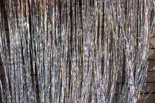 Festive Background. Shiny Tinsel In Silver Shines.