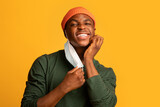 Fototapeta  - Itchy Skin. Irritated Young Black Guy Scratching Face After Wearing Medical Mask