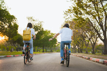 Spring Is Comming Concept With Happy And Cheerful Feeling Of Asian Couple Riding Bicycle Together