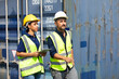 © NVB Stocker - Hispanic Man worker and woman Supervisor dock cargo checking and control loading Containers box at container yard port of import and export goods. Unity and teamwork concept