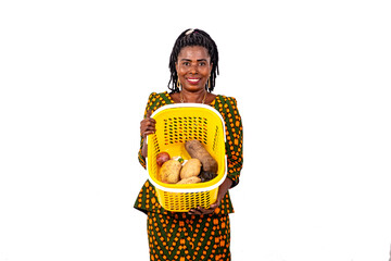 Wall Mural - beautiful housewife showing shopping basket in supermarket while smiling.