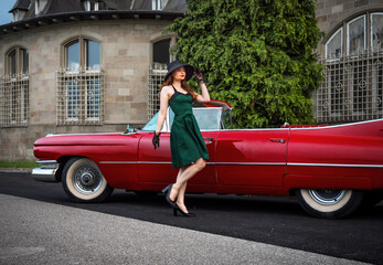 Wall Mural - Old-timer red Cadillac and a beautiful young girl