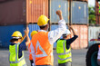 © NVB Stocker - Strike of workers in container yard. Group of multiethnic engineer people during a protest in workplace