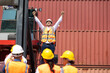 © NVB Stocker - Strike of workers in container yard. Group of multiethnic engineer people during a protest in workplace