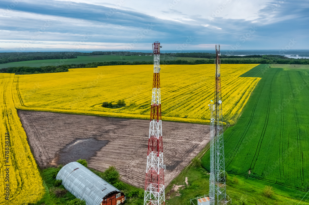 Aerial view video of telecommunication tower in the countryside farming ...