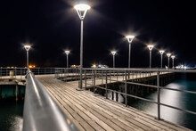 Illuminated Sea Pier At Night