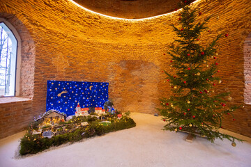 Christmas nativity scene with decorated christmas tree