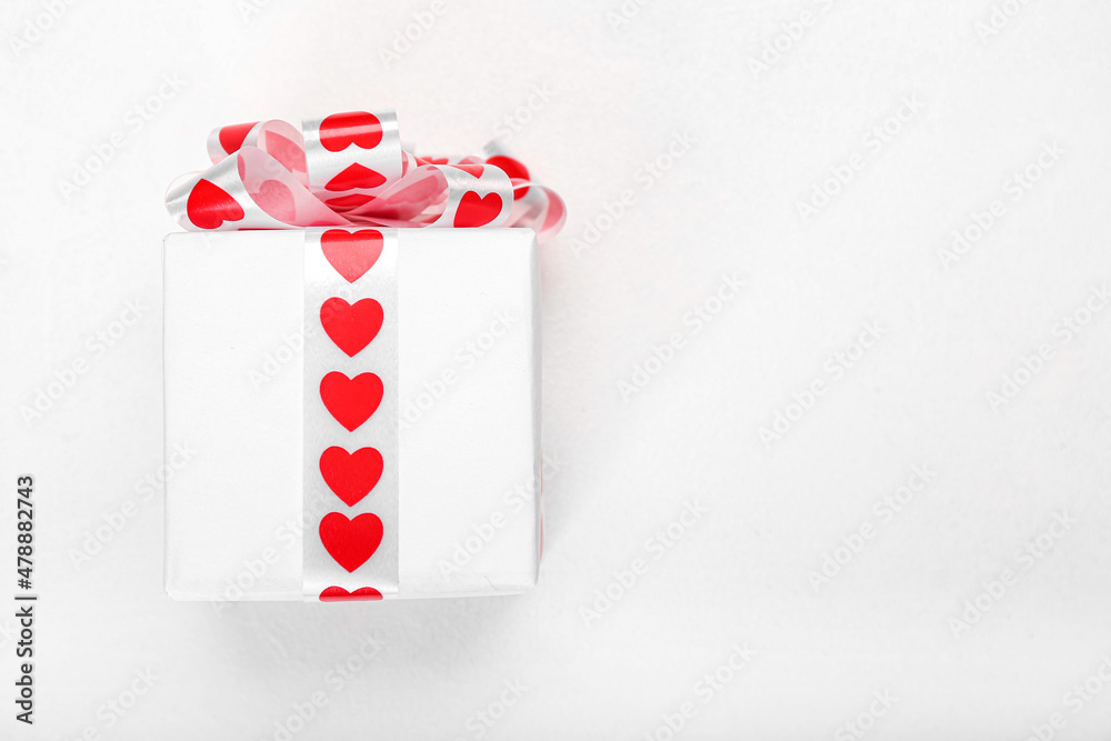 Gift box for Valentine's Day on light background