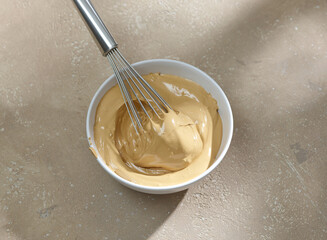 bowl of whipped instant coffee with sugar and water