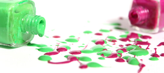 Canvas Print - Pink and Green Spilled Nail Polish on White Background