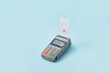 © Yaroslav Danylchenko/Stocksy - Terminal and credit card on light blue background