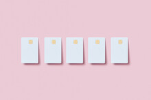 Five Blank Credit Cards On Pink Background