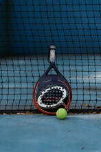 Padel Racket And A Ball On The Court