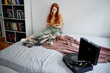 © Oleksii Syrotkin/Stocksy - Beautiful girl listening songs and resting at home