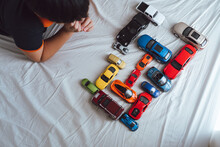 Closeup Image Of The Little Boy Holding The Toy Car