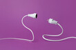 © Yaroslav Danylchenko/Stocksy - Two parts of disconnected extension cord