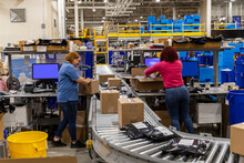 Two workers together at busywarehouse for E-Commerce 