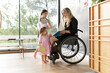 © Santi Nuñez/Stocksy - Mother with a disability enjoying with her daughters