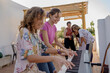 © Eloisa Ramos/Stocksy - Teen girls playing electric organ at party