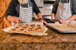 © ByLorena/Stocksy - Teenager and grandfather cooking together