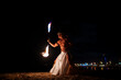 © Igor Kardasov/Stocksy - Latin male with naked torso doing fireshow