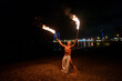 © Igor Kardasov/Stocksy - tribal latino man conducts a fire show