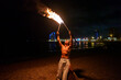 © Igor Kardasov/Stocksy - tribal latino man conducts a fire show