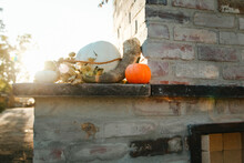 Pumpkins Decorate Outdoor Fireplace Ledge