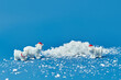 © Yaroslav Danylchenko/Stocksy - White bears figurines among decorative snow