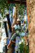 © Kike Arnaiz/Stocksy - Active woman walking on rope course