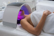 © Aleksandra Jankovic/Stocksy - Woman Under A LED Light Facial Therapy Lamp