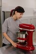 © Liliya Rodnikova/Stocksy - Woman using stand mixer