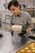 © Liliya Rodnikova/Stocksy - Chef shaping raw cake