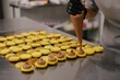 © Liliya Rodnikova/Stocksy - Process of filling macaroons with cream