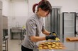 © Liliya Rodnikova/Stocksy - Woman confectioner making macaroons