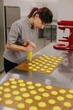 © Liliya Rodnikova/Stocksy - Woman baker cooking macaroons