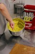 © Liliya Rodnikova/Stocksy - Anonymous baker mixing dough