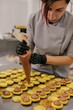 © Liliya Rodnikova/Stocksy - Woman making macaroons in bakery