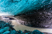 River Goes Through An Ice Cave  