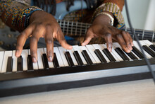 Close Up Of Hands Playing Electric Piano