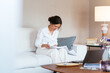 © Manu Padilla/Stocksy - Serious Hispanic woman reviewing papers