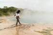 © Kike Arnaiz/Stocksy - Arab woman near steaming geothermal spring