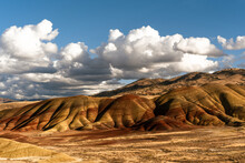 Dramatic Late Afternoon Clouds And Sun Over The Painted Hills