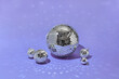 © Yaroslav Danylchenko/Stocksy - Various silver disco balls in studio