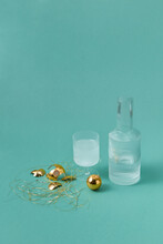 Decanter And Glass With Water Among Baubles