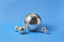 Silver Disco Balls Over Blue Background