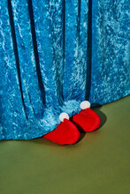 Santas Elf Behind A Curtain