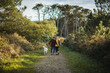 © Daniel Gonzalez/Stocksy - Loving couple with dog in forest